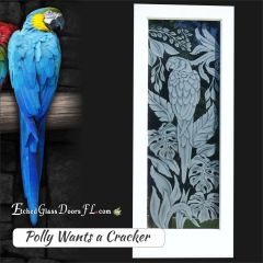 Parrot-on-interior-glass-door-with-leaves