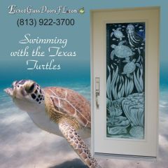 Turtles swimming over seagrass and coral on glass door