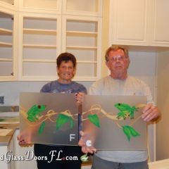 Pat-and-Mike-Kaufman-holding-frosted-cabinet-glass-with-frogs