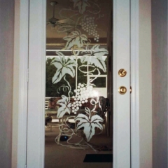 Grape vines etched on entry door