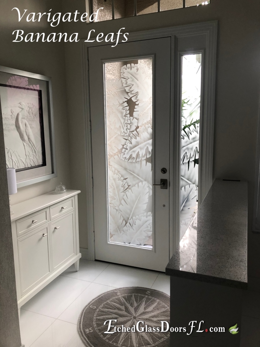 single entry door with palm leafs