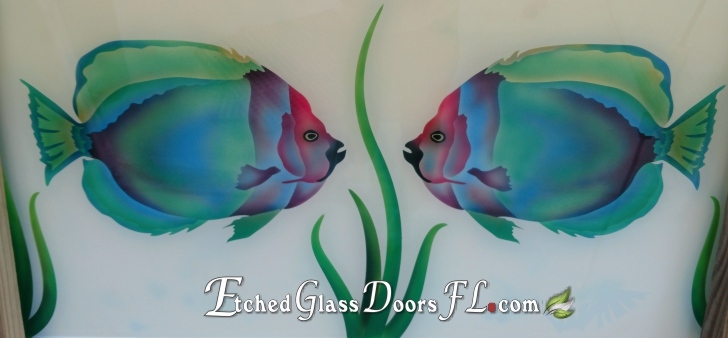 Colorful tropical fish on glass panel